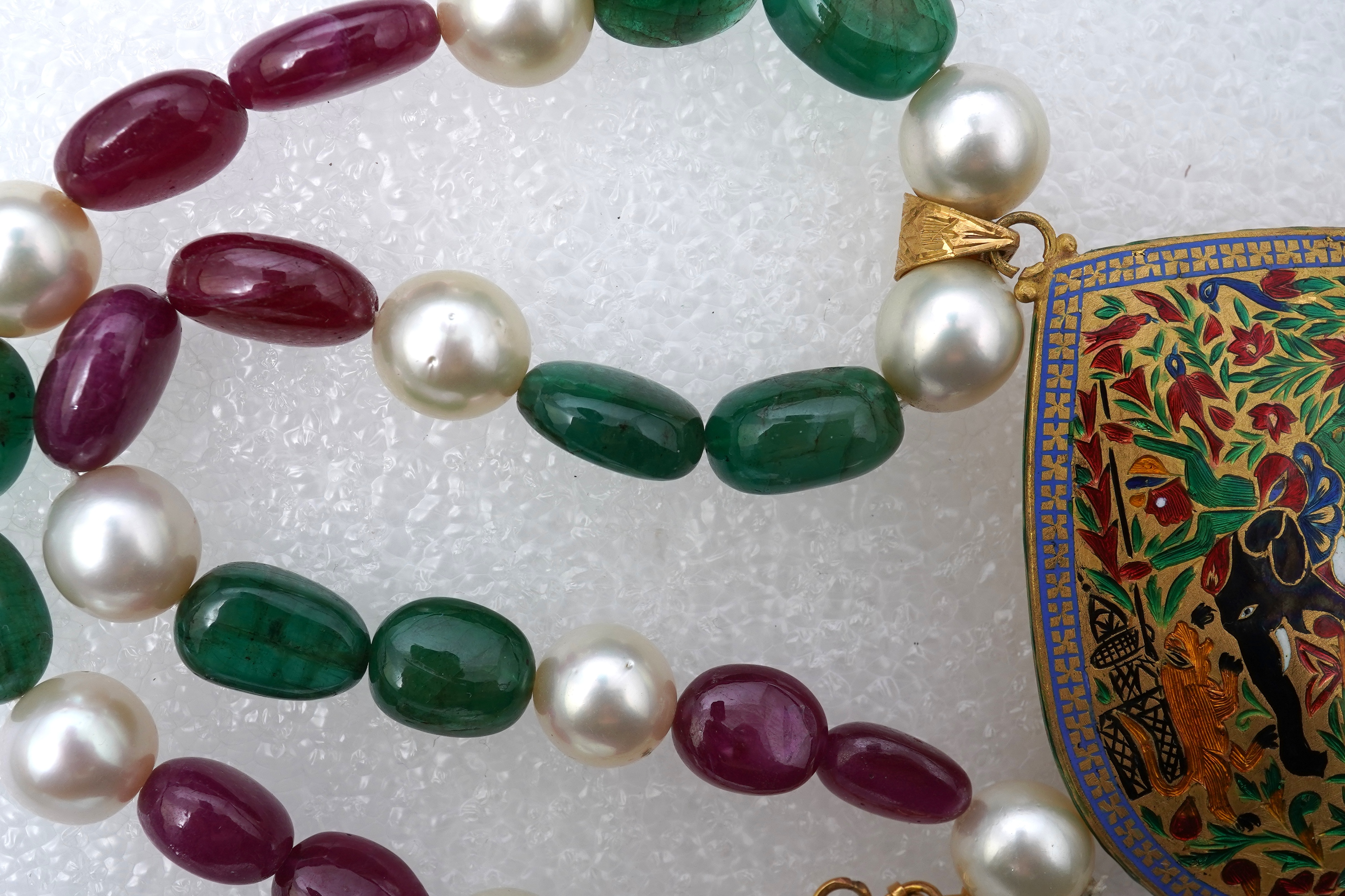 An emerald, ruby, enamel, cultured pearl and diamond demi-parure, India